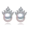 Detailed macro view showing the crown zircon setting and freshwater pearl of 8mm stud earrings - Crown Style / 8mm Pearl / White Pearl