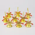 Set of nine golden Christmas bells with red bows and Merry Christmas lettering detail - 9 Pieces Set / Gold
