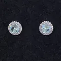 Round halo stud earrings featuring light blue zircon centers and silver-tone plating - Light Blue March