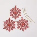 Set aus drei roten Glitzerschneeflocken-Anhängern mit goldenen Schnüren für Weihnachten - 3er-Set / Rot