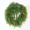 Detailed view of lush green artificial cedar wreath with velvet bow and rustic pine cones. - Bowknot Pinecone Cedar Wreath Garland (H3173) / 50cm