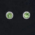Elegant halo stud earrings featuring round green zircon center and clear accent stones - Light Green August