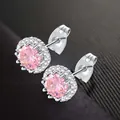 Elegant pink zircon halo stud earrings with a polished silver-tone finish for women - Pink October