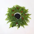 Artificial Christmas cedar pine wreath decorated with cones and a green velvet bow - Bowknot Pinecone Cedar Candle Holder Wreath (ZT020)