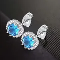 Elegant round blue zircon halo stud earrings with brilliant silver finish and butterfly back - December (Blue)