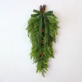 Detailed view of a lush faux cedar Christmas swag featuring a green velvet bow and pinecones. - Bowknot Pinecone Cedar Upside Down Swag (D303) / 70cm