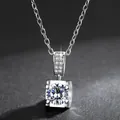 Close-up of a sparkling silver-colored bull-head pendant necklace with brilliant stone. - With Chain / Silver