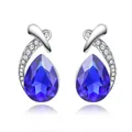 Elegant silver stud earrings featuring blue pear-shaped crystals and small accents - Blue