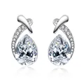 Elegant silver-toned teardrop crystal earrings with pavé-set curved accents on white - Clear