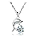 Detailed macro view of silver dolphin pendant necklace with clear sparkling crystals - White