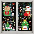 Close-up of Christmas static stickers showing festive characters on glass window - Style XD-310 (006SDJDT23)