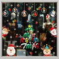 Detail view of festive Christmas static window stickers on a glass storefront - Style XD-307 (006SDJDT23)