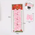 Set van 4 roze fluwelen kerststrikken met afmetingen en gewicht van 30,6 g getoond. - Set van 4 / Roze