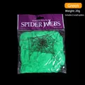 Detail view of 20g green stretchable polyester spider web Halloween decoration with spiders - Green