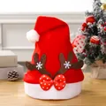 Detail of Christmas Santa hat with reindeer antlers and red polka dot bow decoration - Coffee Brown Antlers