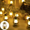 Detailed view of warm glowing retro mini golden lantern LED decorative string lights - Battery Steady-1.5m 10 LEDs / Golden Oil Lamp