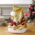 Shiny golden Christmas hat featuring sequined reindeer antlers and a matching golden bow - Plaid Sequin Antler Hat (Gold)