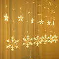 Warm yellow LED curtain string lights with hanging star and snowflake shapes. - Star and Snowflake Curtain Light / Plug-in 220V (Standard Controller) / Warm White