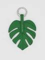 Detailed close-up of a vibrant green Monstera leaf bag charm made of durable PU leather - Monstera Leaf (22718) / Green