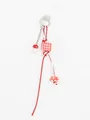 Close-up of handmade red and white woven phone charm with mushroom and checkered bead - Red White Checkered Mushroom Style / Red White