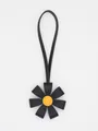 Premium 3D PU leather flower bag charm featuring black petals and yellow center - Black