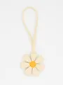 Detail of a white and yellow PU leather 3D flower bag charm with long strap - Cream White