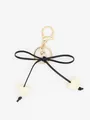 Minimalist black bow keychain featuring cream heart charms for handbags and car keys - White Heart With Black Rope