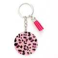 Detailed macro view of pink leopard print acrylic keychain with vibrant matching pink tassel - Leopard Pink