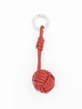 Detailed view of a handmade red PU leather woven ball keychain for bags and phones - Dark Red (22342-1)