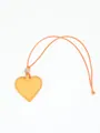 Detail view of a heart-shaped yellow PU leather magnetic glasses holder with strap. - Bright yellow