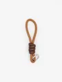 Detail of brown PU leather braided keychain with dark brown knot and silver ring - Camel Color Block