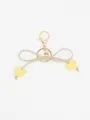 Adorable beige bow keychain featuring yellow macaron heart charms for car keys or backpacks - Yellow Heart With Beige Rope