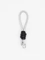 Silver braided cord wrist strap keychain with black leather knot and metal ring detail - Silver Black Splice