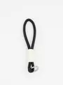 Detail view of a minimalist black and white PU leather braided wrist strap keychain - Black and White Patchwork