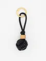 Detail view of handmade black PU leather woven ball keychain with wooden bead - Black with Wood Bead (22594)