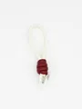 Detail showing white braided PU leather wrist strap with burgundy knot and metal ring - White and Red