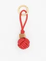 Detailed macro view of red PU leather woven ball keychain with a natural wooden bead accent - Red with Wood Bead (22590)