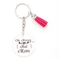 Acrylic round keychain featuring a pink tassel and Oh Honey I AM That Mom printed text. - Oh Honey I Am That Mom Flower