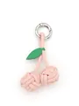 Detailed view of a handmade pink woven PU leather cherry charm with silver metal ring. - Cherry Woven Pendant (22063) / Light Pink