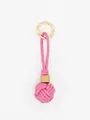 Detailed view of a pink PU leather braided ball keychain with a wooden bead accent - Rose Pink (22589)