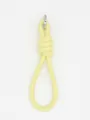 Close-up of minimalist pale yellow PU leather knotted wrist strap with silver clasp - Light Yellow