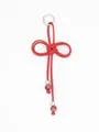 Detailed macro view of a red handmade braided PU rope keychain with purple beads and metal ring - Red