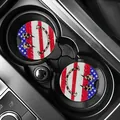 Close-up detail of American flag car coasters with leopard print smiley face in cup holder - Leopard Flash Smile (80095) / Two-Piece Set