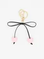 Charming black ribbon bow keychain featuring two pink macaron heart beads and gold clasp - Pink Heart With Black Rope