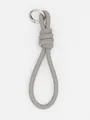 Grey PU leather braided strap keychain with silver metal ring and white stitching detail - Gray