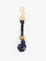 Detailed view of handmade floral fabric woven ball charm with wooden bead and gold clasp - Colorful Floral (22600)