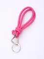 Close-up detail of a bright pink hand-braided PU leather phone lanyard with silver ring - Bright Pink (20840)