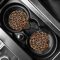 Set of leopard print car coasters shown inside a black center console cup holder - Vintage Leopard (80100) / Two-Piece Set