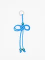 Close-up of a handmade light blue woven rope keychain with a beaded bow design detail - Sky Blue