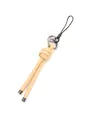 Detailed macro view of the handmade beige braided leather knot charm keychain strap - Cream (21565)